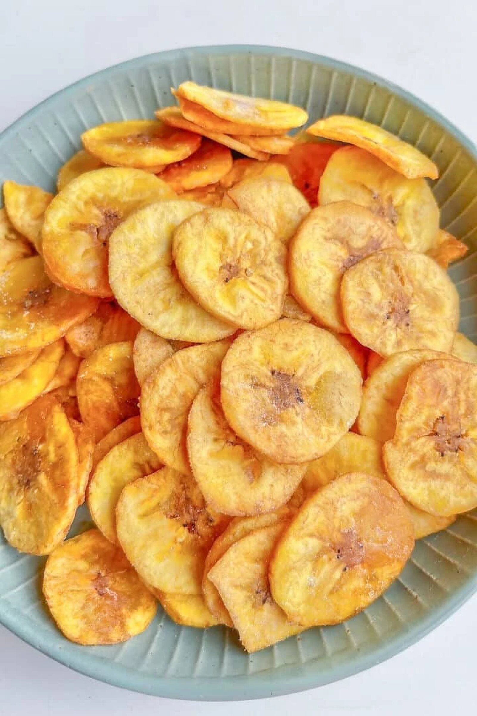 Freshly fried golden plantain chips